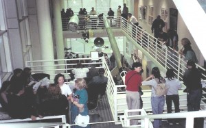 Guests watching one of the scientist presentations from the balcony above the atrium