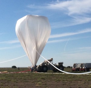 A NASA high-altitude balloon is inflated with helium in preparation for the HySICS science demonstration flight on August 18, 2014. (Courtesy NASA Balloon Program Office)