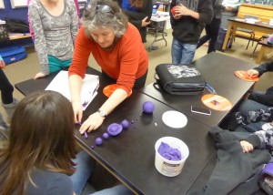 LASP planetary scientist, Fran Bagenal, helps Hayden Middle School students construct a clay model of the solar system during her visit to the rural Colorado community. (Courtesy Fran Bagenal/LASP)