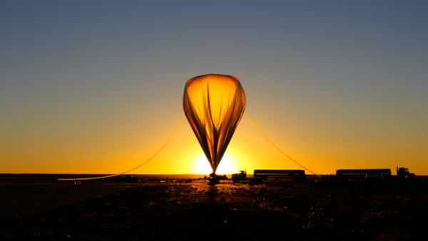 The launch of a high-altitude sounding balloon at sunrise.