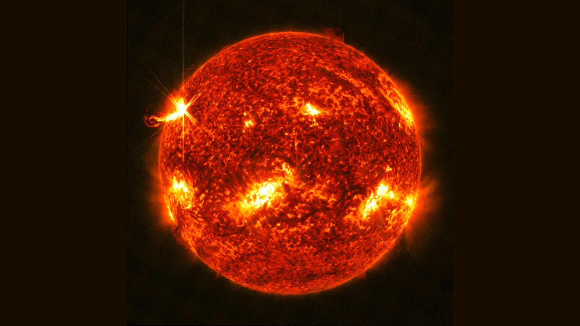 An X1.0 class solar flare flashes on the left edge of the Sun on January 10, 2023. This image was captured by NASA's Solar Dynamics Observatory and shows a blend of light from the 304 and 131 angstrom wavelengths. Credit:NASA/GSFC/SDO