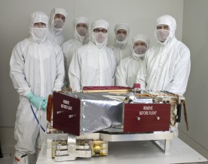 LASP mechanical engineers pose with the MAVEN Remote Sensing Package and its Imaging Ultraviolet Spectrograph (IUVS) shortly before the package was delivered to Lockheed Martin for integration onto the spacecraft. (Courtesy LASP/Aref Nammari)