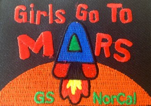 The Girls Go to Mars badge was designed by participants in the first program workshop. Program participants earn the badge by completing kits activities, which teach Girl Scouts about MAVEN-related Mars science. (Courtesy LASP)