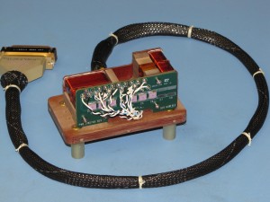 The MAVEN magnetometer sensor assembly includes a phenolic sensor block (brown), nested sense and feedback coils, and sensor printed circuit board. The sensor is provided with a (shielded) pigtail connector to insure that interconnect hardware is kept at a sensible distance from the sensor. (Courtesy NASA/GSFC)