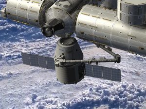 Artist rendering of the SpaceX Dragon spacecraft being berthed to ISS