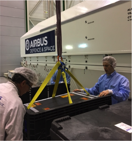 The GOLD instrument arrives in its shipping container at Airbus Defence & Space in Toulouse, France on January 4, 2017. Team members performed successful tests, inspection, and checkout of the instrument, which will next be mounted on the SES-14 commercial communications satellite that will carry GOLD for its planned two-year mission. (Courtesy Airbus)