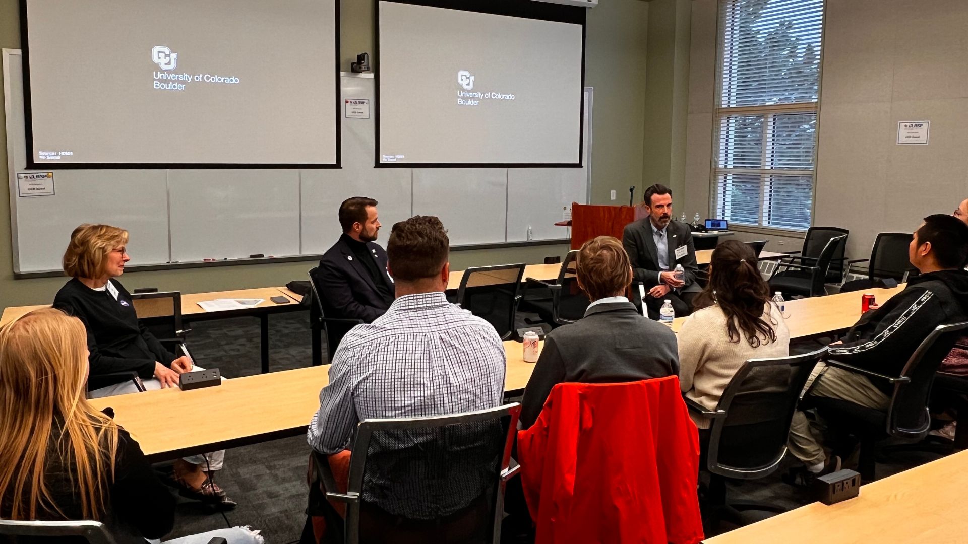 Leaders from NASA's Heliophysics Division, including Deputy Director Peg Luce (left), Director Joe Westlake (middle), and Space Weather Director Jamie Favors, met with LASP graduate students and early career researchers. Credit: LASP