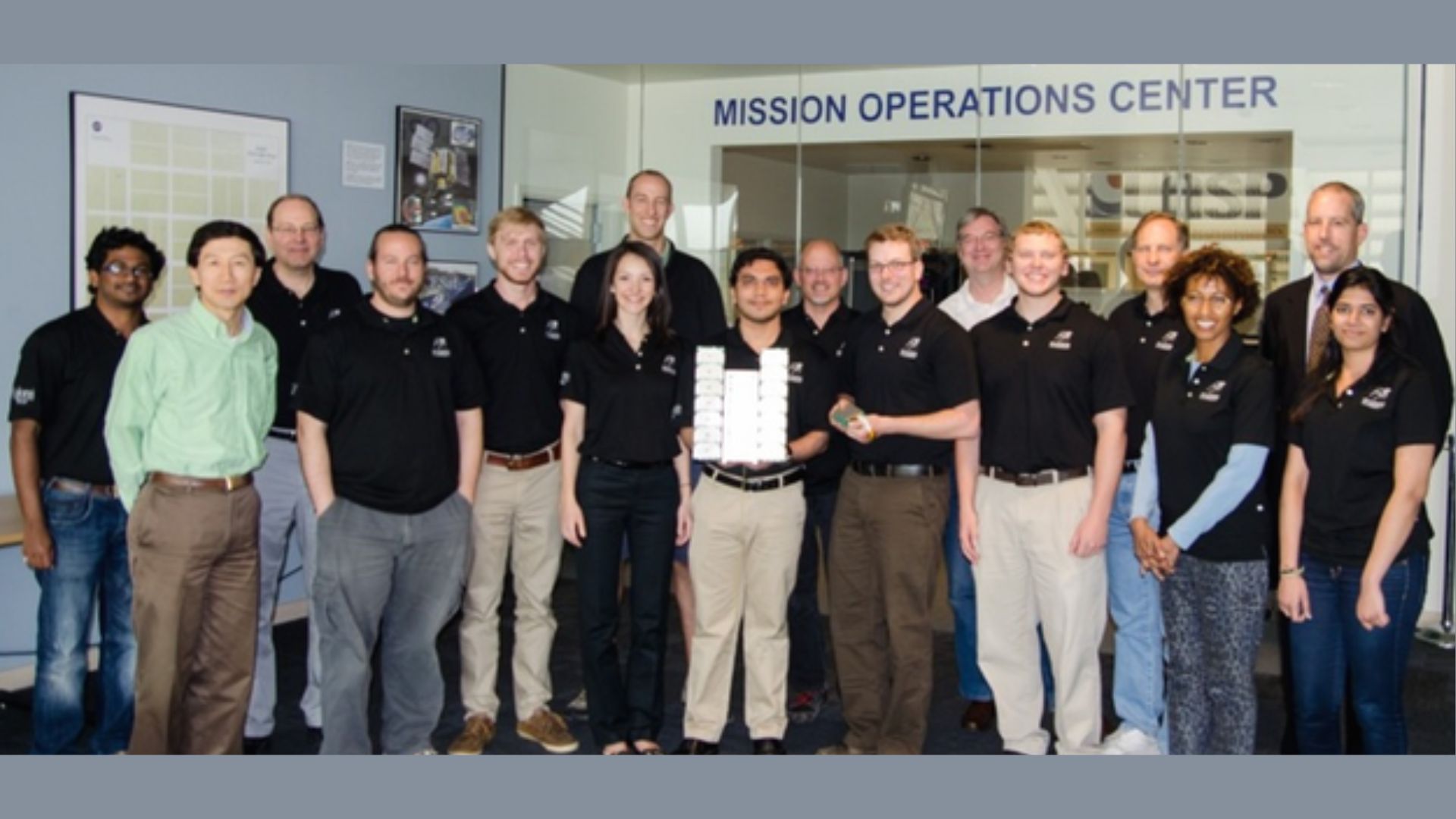 The Miniature X-ray Solar Spectrometer (MinXSS) team in April 2014 prior to the launch of MinXSS-1. The 4-year project to design, build, integrate, test, and operate a small satellite to be launched into low-Earth orbit to take observations of the sun involved many students. Credit: LASP