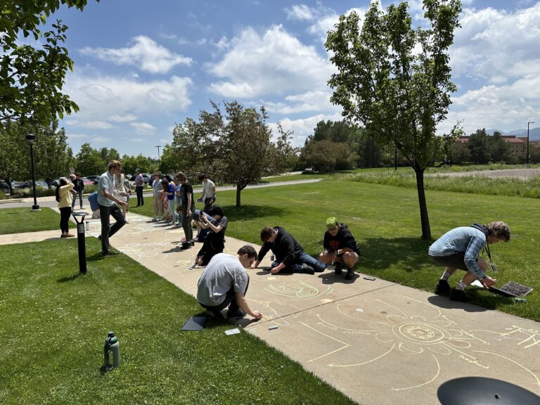 The 2024 Boulder Solar Alliance cohort working on the final activity of bootcamp, in which students learned about the fundamentals of solar and space physics and programming skills. Credit: LASP