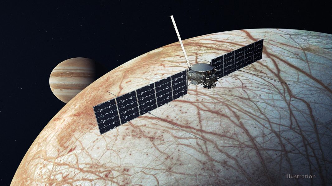 Artist's drawing of Europa Clipper flying above Jupiter's moon Europa