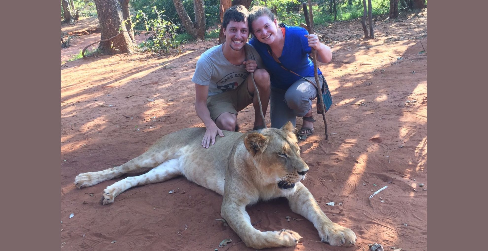 Kristin Gutierrez and her fiancé pictured with a lion in Solwezi, Zambia, where the couple met while volunteering with the Peace Corps. Credit: Kristin Gutierrez