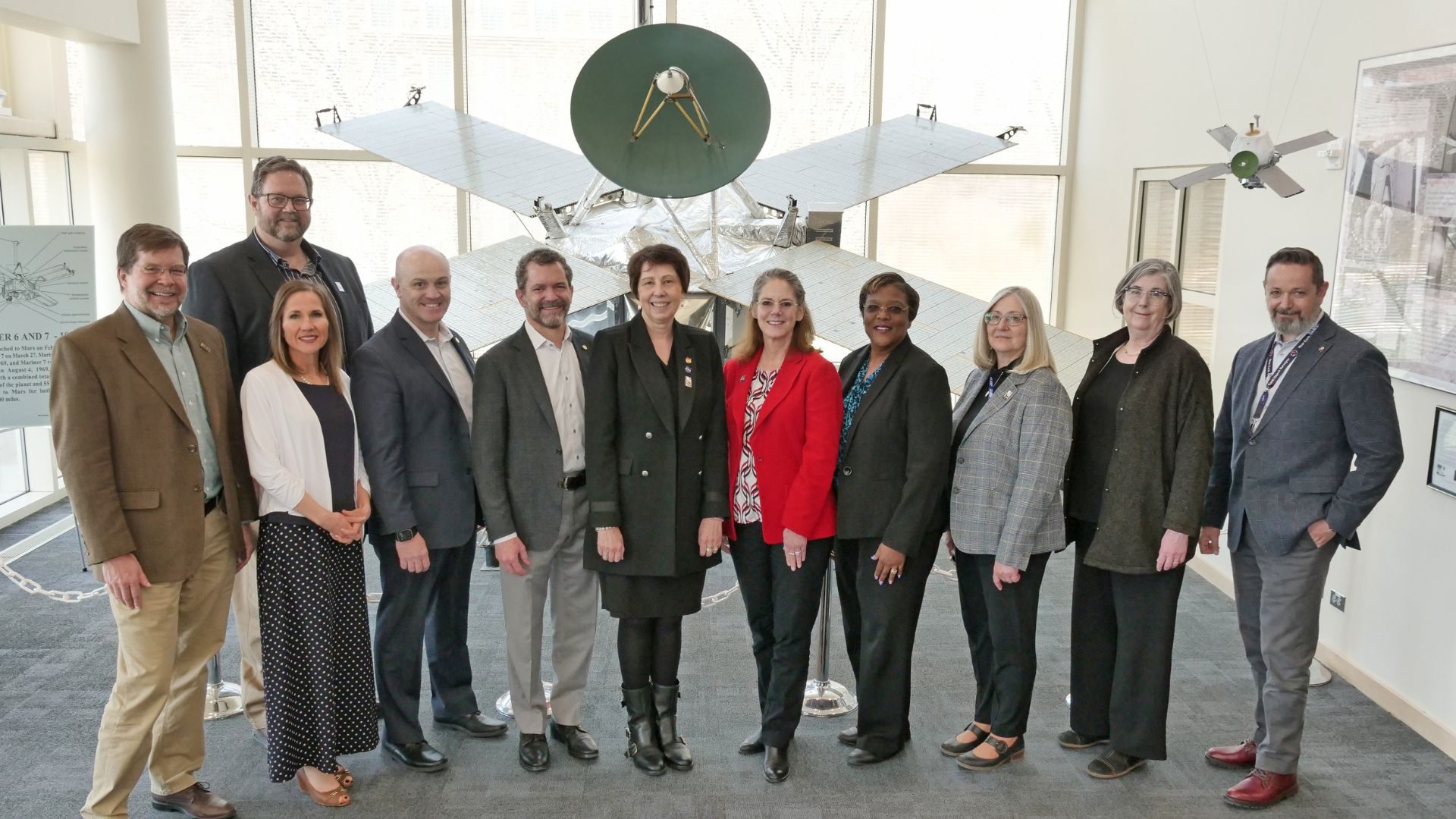 University of Colorado President Todd Saliman and LASP officials met with Nicola Fox, associate administrator for NASA's Science Mission Directorate, and her SMD colleagues. Seen here in front of the Mariner spacecraft displayed in LASP's lobby are (from left to right): Carl Gelderloos and Frank Eparvier of LASP; Danielle Radovich Piper, Massimo Ruzzene and Todd Saliman of CU; Nicky Fox, Sandra Connelly, and Wanda Peters of NASA; Pam Millar of LASP; Carolyn Mercer of NASA; and Stephen Ettinger of LASP. Credit: Casey A. Cass/University of Colorado/LASP